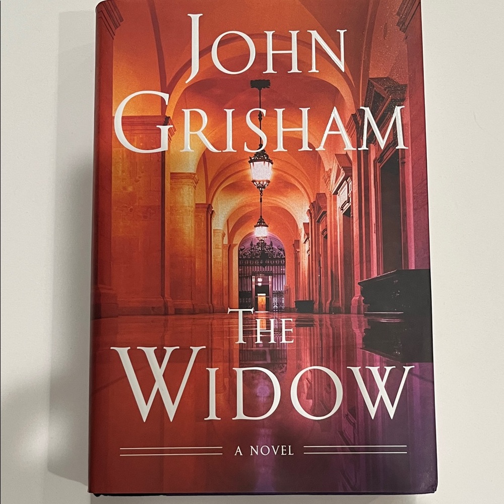John Grisham "The Widow" Hardcover - Red/Orange Cover